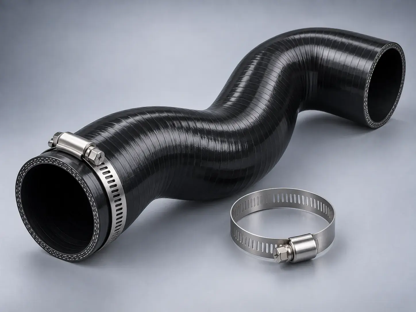 A new reinforced silicone charge air hose with two stainless steel clamps